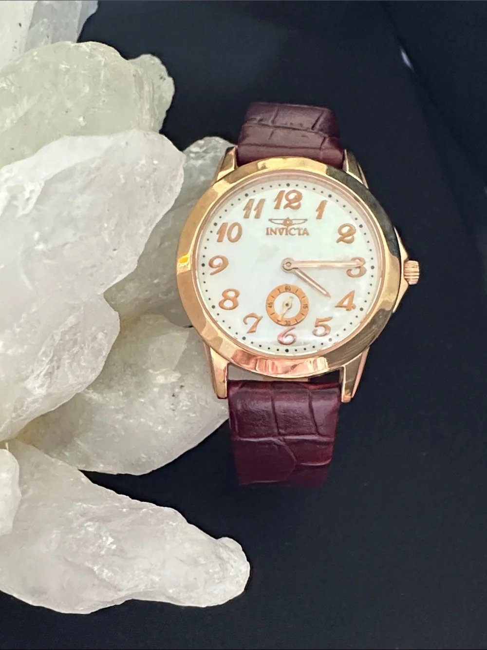 Invicta EUC genuine mother of pearl & rose goldtone watch. Genuine leather band
